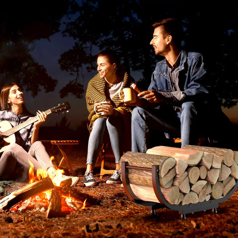 Group enjoying outdoor campfire with Beefy Firewood Rack For Outdoor Use, 29 Inch Log Holder, Black Steel Frame visible nearby.