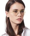 Person wearing Classic Polarized Aviator Sunglasses With Gold Frames And Photochromic Grey Lenses, 58mm, Medium Fit For Men And Women.