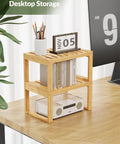 Heavy Duty Bamboo Cabinet Organizer Shelf Two Pack Stackable Kitchen Counter Rack Featuring Slatted Draining Surface To Air Out Dishes And Keep Counters Squeaky Clean on a desktop holding books and pens.