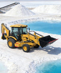 Compact Backhoe Loader With Towable Excavator Arm in snowy landscape for earthmoving and construction work