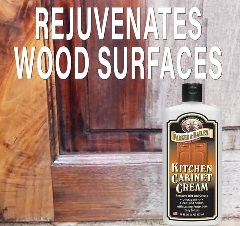 Bottle of Kitchen Cabinet Creme Cleaner And Grease Remover For Wood Surfaces, No Fuss 16 Oz, next to wooden cabinet door.