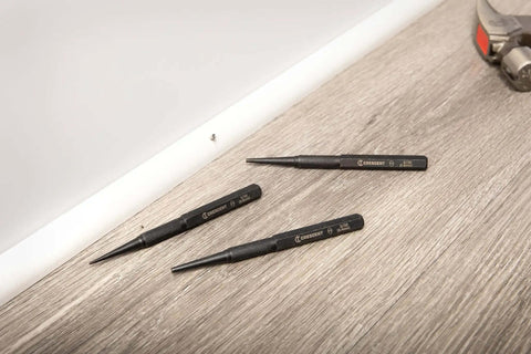 Pro Grade 3 Piece 5 Inch Steel Punch Set With Black Oxide Finish, Laser Etched Size Markings 1/32 2/32 3/32 Inch on a wooden surface