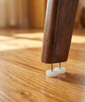 No Slip Chair Glides 0.94 Inch Nail-On Furniture Leg Protectors in use on wood floor, close-up of nail-on design and material.