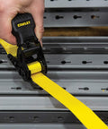 One Inch By Ten Foot Ratchet Tie Down Straps, 500 Pound Safe Working Load, Quick Grab Handle in use on metal platform