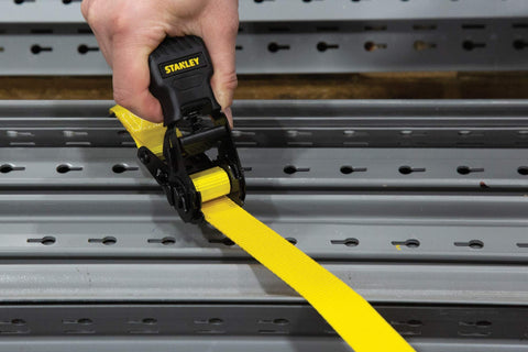 One Inch By Ten Foot Ratchet Tie Down Straps, 500 Pound Safe Working Load, Quick Grab Handle in use on metal platform