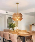 17.3" 17.3 Inch Rattan Pendant Light, Boho Wicker Chandelier for Dining hanging over a wooden dining table.