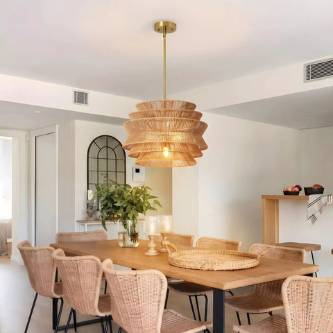 17.3" 17.3 Inch Rattan Pendant Light, Boho Wicker Chandelier for Dining hanging over a wooden dining table.