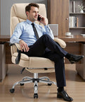 Big And Tall Office Chair 400lbs With Wide Memory Foam Seat in khaki with a footrest in office setting