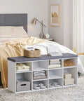 12 Cubby Shoe Storage Bench With Cushioned Seat And Adjustable Shelves White Entryway Organizer in bedroom setting