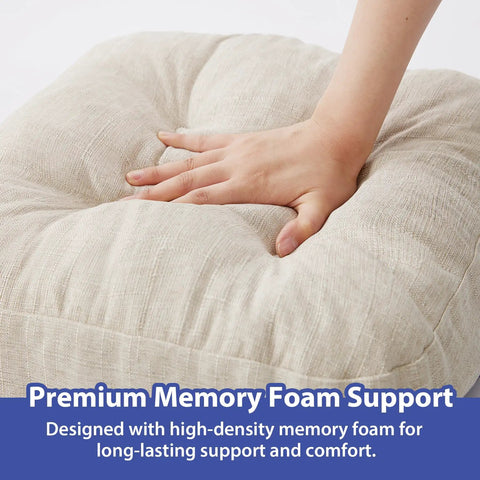 Close-up of a beige tufted indoor chair pad with memory foam support being pressed by a hand, showcasing the cushion's softness.