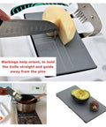 Slice N Fun adaptive cutting board with pins and non-slip tray; gray wood-plastic, one-handed use; crinkle cutter shown