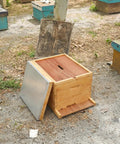 Beekeeping Beehive 3-Piece Parts Kit With Top Cover, Inner Cover, And Bottom Board in outdoor apiary setting