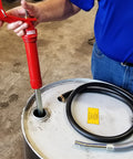 Person using Lincoln 1335 Lever Action Fluid Transfer Pump For 16 To 55 Gallon Drums With 8.5 Fluid Ounces Per Stroke, 2 Inch Bung