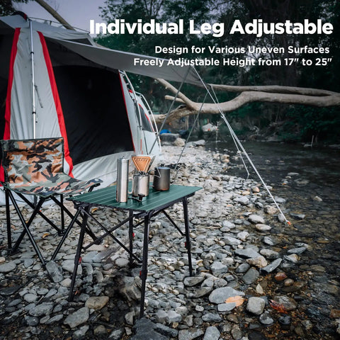 Ultra Lightweight Aluminum Folding Camping Table with Adjustable Legs by a tent in rocky terrain
