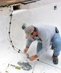 Man applying Flex-H20 Polyurethane Crack Sealer injects deep into concrete and masonry cracks from tiny to quarter inch flexible leak proof patch quick cure 9 oz go-to anchoring restoration and strengthening in pool wall