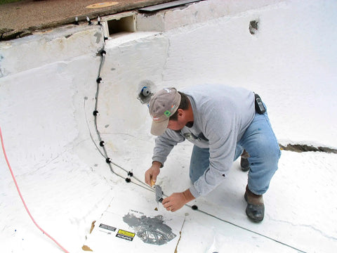 Man applying Flex-H20 Polyurethane Crack Sealer injects deep into concrete and masonry cracks from tiny to quarter inch flexible leak proof patch quick cure 9 oz go-to anchoring restoration and strengthening in pool wall