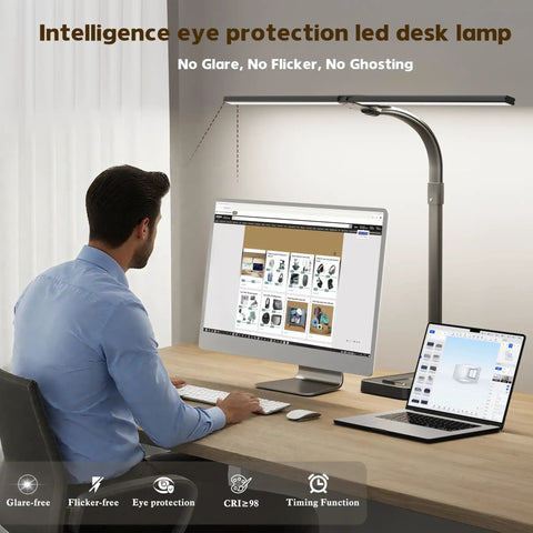 Man using Dual Head LED Desk Lamp For Home Office With Eye Caring Light, Architect Style Gooseneck Desk Light For Multi Monitor Setup