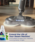 Bissell steam mop cleaning floor with Eucalyptus Mint Demineralized Steam Mop Water, 32 Oz, white, fresh scent cleaning solution.