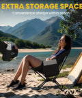 Woman relaxing on an ultra lightweight folding camping chair for hiking and backpacking, set of two with carry bag, ultralight beach chair that supports up to 330 lbs, compact park and camp gear for adults, outdoor adventure ready, by a tent near a scenic lake.