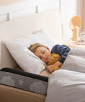High Grade Foam Bed Rail Bumpers For Tots And Silver Folks With Heavy Duty Non Slip Base Quick Wash Cover displayed next to sleeping child.