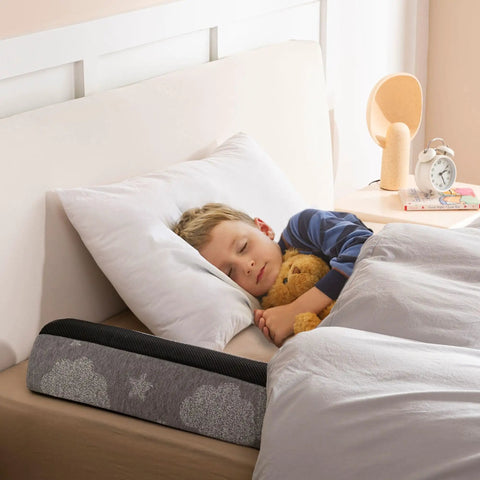 High Grade Foam Bed Rail Bumpers For Tots And Silver Folks With Heavy Duty Non Slip Base Quick Wash Cover displayed next to sleeping child.