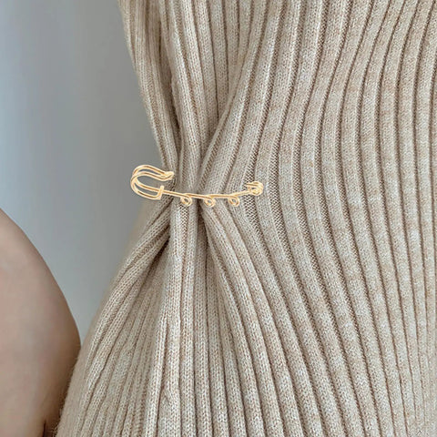 Top Shelf Loop Safety Pin Brooch Set Of Twenty Pieces Electroplated In Rich Golden Tone For Sweaters Coats And Jackets Featuring Reliable Non Slip Clasp To Keep Your Threads Secure on a ribbed sweater.