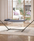 Double Hammock With Stand Heavy Duty 450Lbs Capacity Rugged Steel Frame Quilted Cushion And Storage Net For Backyard Chill Sessions Patio Camping Indoor Outdoor Use Dark Gray, displayed indoors with light streaming through windows.