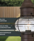 Close-up of Outdoor Lantern Post Light With Rustic Bronze Finish, seedy glass shade, classic scroll arm, showing steel construction.