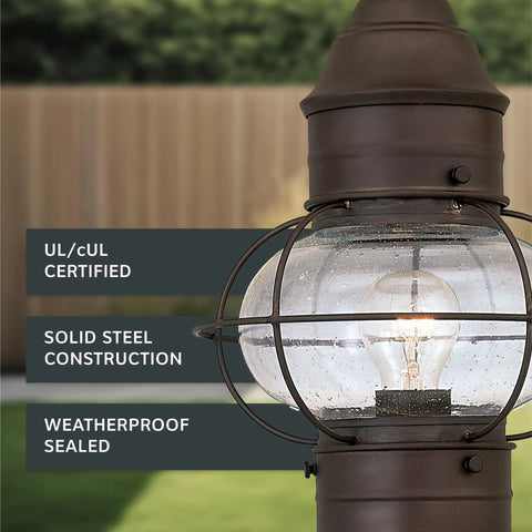 Close-up of Outdoor Lantern Post Light With Rustic Bronze Finish, seedy glass shade, classic scroll arm, showing steel construction.