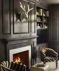 Oversized Six Light Wall Sconce In Matte Charcoal Painted Finish Killer Lodge Style Decor For Big Time Dining Room Glow and Game Changing Rustic Home Accents mounted above a fireplace in a stylish living room.