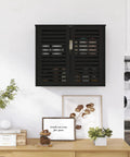 Black Bamboo Over The Toilet Wall Mounted Bathroom Storage Cabinet With Three-Position Adjustable Shelf Hanging Medicine Cabinet With Double Doors Space Saver Organizer For Bathroom Essentials installed over a wooden console.