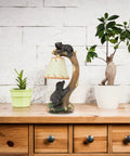 Cozy Cabin Vibes Table Lamp With Hand Painted Tree Climbing Bears Night Light on wooden desk with plant décor.
