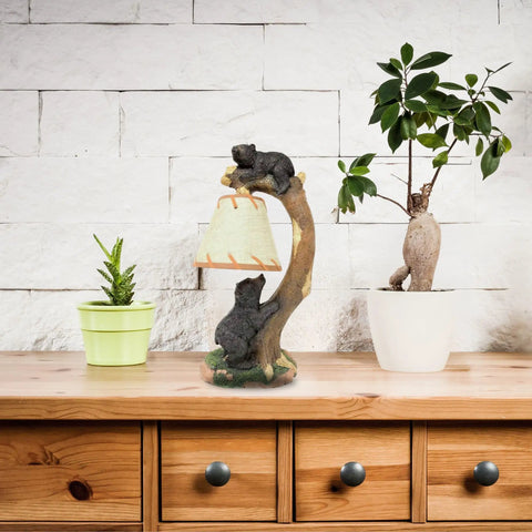 Cozy Cabin Vibes Table Lamp With Hand Painted Tree Climbing Bears Night Light on wooden desk with plant décor.