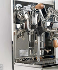 Pro Grade Dual Boiler Espresso Maker With PID Precision Tuning hardened stainless frame close-up of steam wand and portafilter.