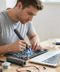 Compact Pen Shaped Cordless Electric Screwdriver Kit Packing 52 Magnetic Bits And Bright Led Lamp for laptop repairs on a table.