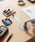 Heavy Duty Force Sensing Resistor With A No Stress Setup For 0 To 30 Kilograms Of Pressure Mapping and Snappy Analog Response On The 30 Mm Round Pad being tested with a weight on a workspace.