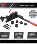 Mini Rod Bender Tool For Metalwork Universal Bending Machine with accessories, featuring red rubberized grip handle on a workbench.