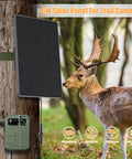 Rugged Trail Camera Solar Panel And 6W Solar Charger Kit for hunting cameras attached to tree near deer, outdoor setting