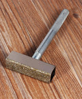Tough As Nails Grinding Wheel Dresser And Bench Grinder Tool Rest for truing metal parts, showing knurled handle and metal head.