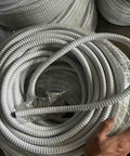 Heavy Duty PVC Coated Flexible Metal Conduit Tough As Nails Corrugated Electrical Wire Hose Fire Resistant Cable Tubing in slick milk color.