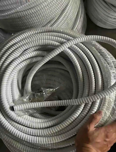 PVC Coated Flexible Metal Conduit For Indoor Outdoor Wiring Jobs Built Like A Tank To Shield Your Cables With Real Deal Fire Resistant Corrugated Tubing At Thirty Two Feet Long, rolled neatly in coils.