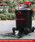 Heavy Duty 10 Gallon Wet Dry Vacuum With 4.5 Peak HP Motor And Three In One Cleaning, shown draining liquid outdoors