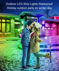 Couple embracing outdoors with colorful 100Ft Outdoor LED Strip Lights Waterproof IP68 creating a festive winter atmosphere.