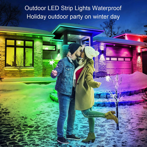 Couple embracing outdoors with colorful 100Ft Outdoor LED Strip Lights Waterproof IP68 creating a festive winter atmosphere.