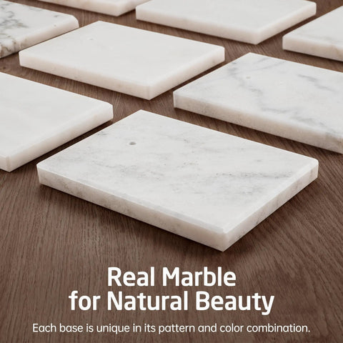 Marble bases of Tall Free Standing Toilet Paper Holder With Marble Base displayed on a wooden surface