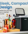Compact Pebble Ice Maker For Countertop, Nugget Ice Machine displayed on kitchen counter with bottles and glassware.