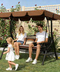 Family sitting on Three Seat Outdoor Patio Swing Chair With Large Convertible Canopy Porch Glider Hammock Lounge Chair For Porch Rattan Wicker Steel Frame Cushions And Pillows Brown