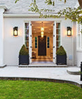 All Weather Outdoor Wall Lantern Built Tough For Rain Or Shine Weather Resistant Rock Solid Waterproof Rust Proof Exterior Sconce Lamp For Front Porch illuminating entrance of modern home.