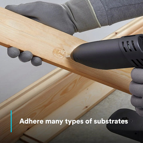 Applying Hot Melt Adhesive 3792 AE Clear, Multi Purpose Glue For Woodworking And Upholstery on wooden board, close-up