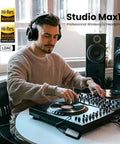 DJ using Ultra Low Latency Wireless DJ Headphones With 20ms Lag, 120 Hour Battery, Hi Res LDAC Audio, Dual Mic ENC, in studio.